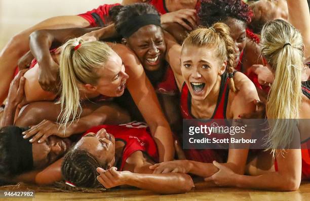 Helen Housby, who scored in the final second and her England teammates celebrate at full time and winning the Netball Gold Medal Match between...