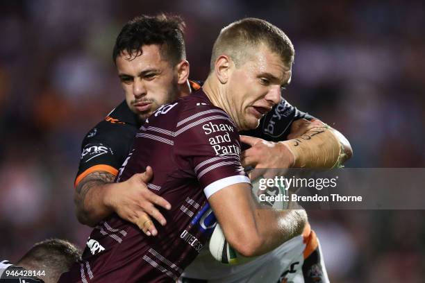 Thomas Trbojevic of the Sea Eagles is tackled by the Tigers defence during the round six NRL match between the Manly Sea Eagles and the Wests Tigers...