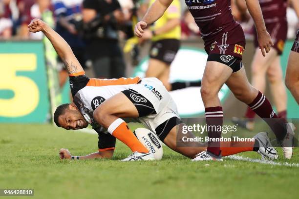 Benji Marshall of the Tigers celebrates after scoring a try during the round six NRL match between the Manly Sea Eagles and the Wests Tigers at...