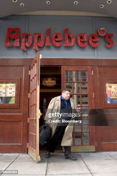 Customer Steve Weinstein leaves an Applebee's Restaurant in Boston, Massachusetts, Tuesday, Feb. 13, 2007. Applebee's International Inc., the...