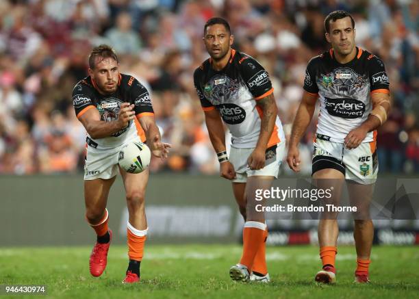 Josh Reynolds of the Tigers passes the ball to a team mate during the round six NRL match between the Manly Sea Eagles and the Wests Tigers at...