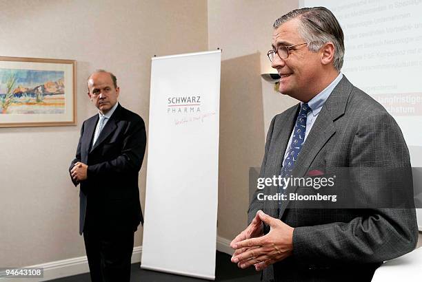 Chief Executive Officer Roch Doliveux, left, listens as Schwarz Pharma Chief Executive Officer Patrick Schwarz-Schuette speaks at a press conference...