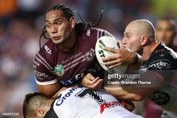 Martin Taupau of the Sea Eagles is tackled by the Tigers defence during the round six NRL match between the Manly Sea Eagles and the Wests Tigers at...