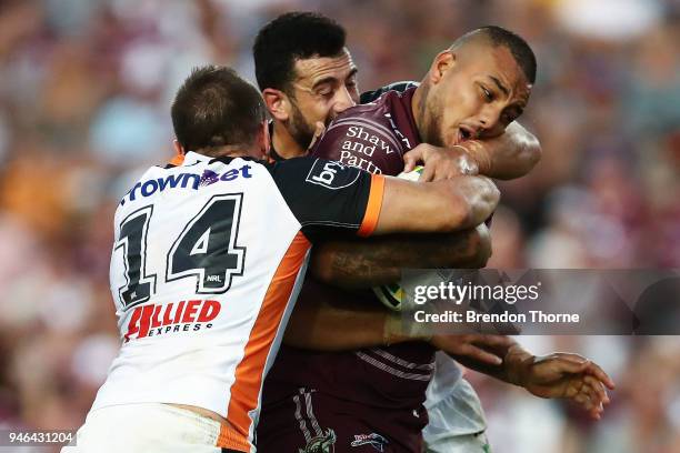 Addin Fonua-Blake of the Sea Eagles is tackled by the Tigers defence during the round six NRL match between the Manly Sea Eagles and the Wests Tigers...