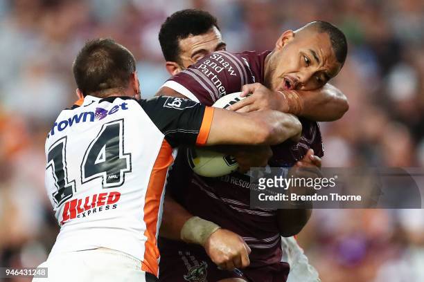 Addin Fonua-Blake of the Sea Eagles is tackled by the Tigers defence during the round six NRL match between the Manly Sea Eagles and the Wests Tigers...