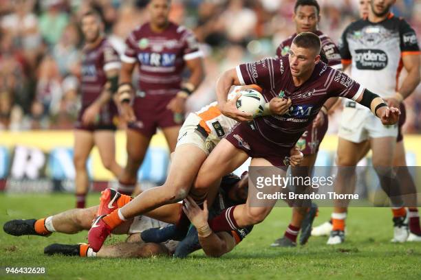 Jack Gosiewski of the Sea Eagles is tackled by the Tigers defence during the round six NRL match between the Manly Sea Eagles and the Wests Tigers at...