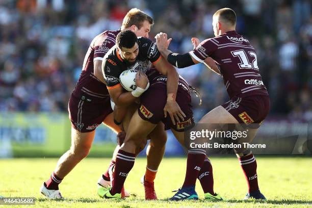 Ben Matulino of the Tigers is tackled by the Sea Eagles defence during the round six NRL match between the Manly Sea Eagles and the Wests Tigers at...