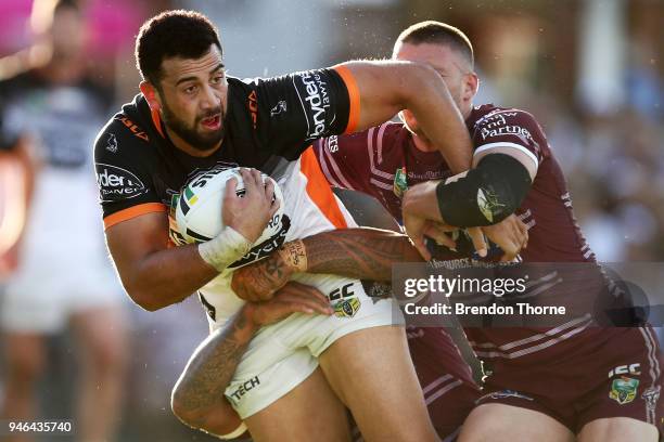 Ben Matulino of the Tigers is tackled by the Sea Eagles defence during the round six NRL match between the Manly Sea Eagles and the Wests Tigers at...