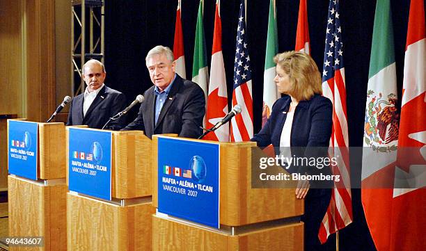 Canadian Minister for International Trade David Emerson, center, speaks during a news conference in Vancouver, Canada, Tuesday, Aug. 14, 2007 as...