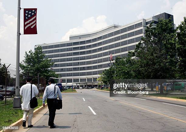 Pedestrians walk near the James J. Peters Veterans Affairs Medical Center in Bronx, New York, Monday, July 10, 2006.