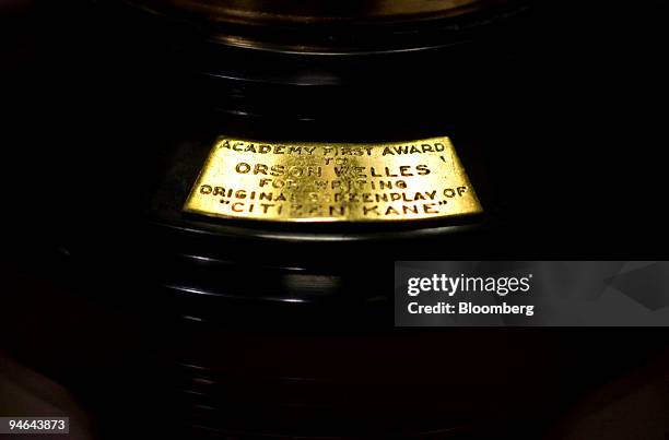 Brass plaque on the gold-plated Oscar statue awarded to Orson Welles for best original screenpay of 1941 for "Citizen Kane" sits in a display case at...