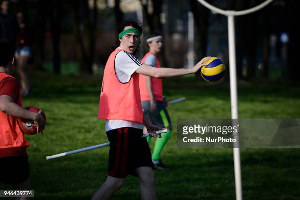 People are seen practicing the fictional Quidditch ball game in Mokotowski Park in Warsaw, Poland on April 14, 2018. Quidditch is a contact sport...