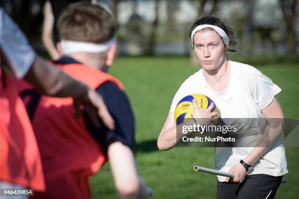 People are seen practicing the fictional Quidditch ball game in Mokotowski Park in Warsaw, Poland on April 14, 2018. Quidditch is a contact sport...