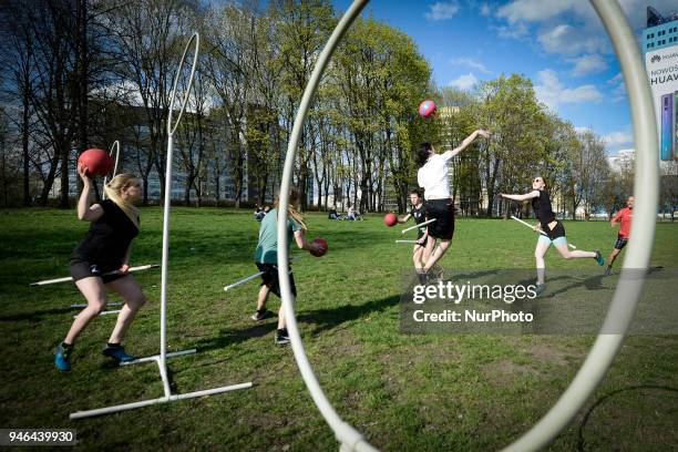 People are seen practicing the fictional Quidditch ball game in Mokotowski Park in Warsaw, Poland on April 14, 2018. Quidditch is a contact sport...