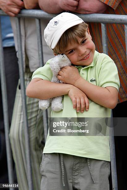 Five-year-old Paul Lausberg hugs his stuffed Knut the baby polar bear doll, while waiting to see the real bear, back on display for visitors after a...