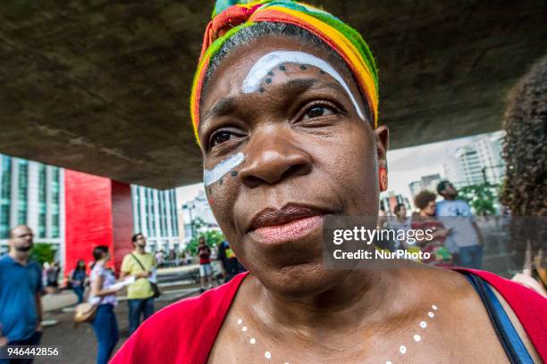 People gather in Paulista Avenue, Sao Paulo, Brazil on April 14, 2018 during a demonstration marking one month of activist Marielle Franco's murder....