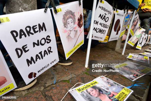 People gather in Paulista Avenue, Sao Paulo, Brazil on April 14, 2018 during a demonstration marking one month of activist Marielle Franco's murder....