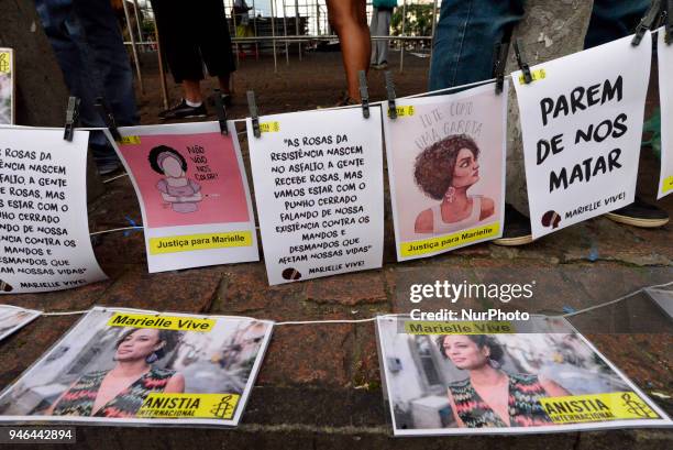 People gather in Paulista Avenue, Sao Paulo, Brazil on April 14, 2018 during a demonstration marking one month of activist Marielle Franco's murder....