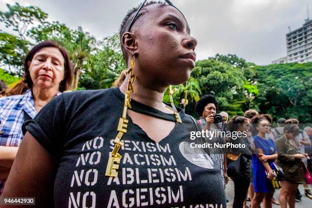 People gather in Paulista Avenue, Sao Paulo, Brazil on April 14, 2018 during a demonstration marking one month of activist Marielle Franco's murder....