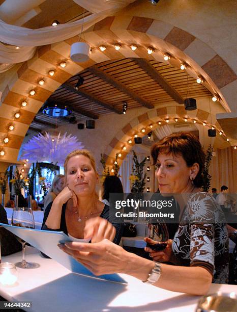 Nancy Pastor, left, and Camille Passaro look over the menu at Barbounia in New York on Tuesday, May 16, 2006.