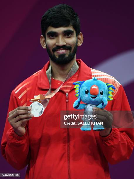 India's Srikanth Kidambi poses on the podium with the silver medal after the men's badminton final at the 2018 Gold Coast Commonwealth Games on the...