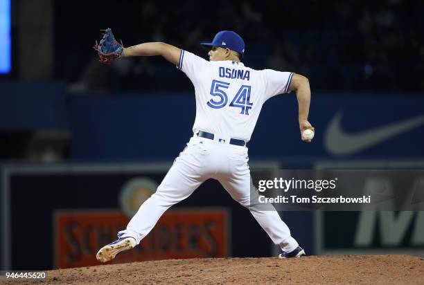 Roberto Osuna of the Toronto Blue Jays delivers a pitch in the ninth inning during MLB game action against the New York Yankees at Rogers Centre on...