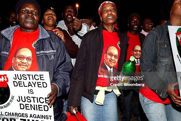 Supporters march around Freedom Square in Pietermaritzburg, KwaZulu-Natal, South Africa, Sunday night, July 30, 2006 pledging their support for Jacob...