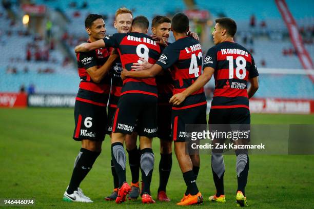 Wanderers players celebrate after Oriol Riera scored a goal from the penalty spot during the round 27 A-League match between the Western Sydney...