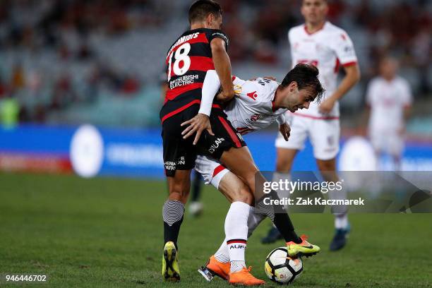 Christopher Ikonomidis of the Wanderers challenges Nikola Mileusonic of Adelaide during the round 27 A-League match between the Western Sydney...