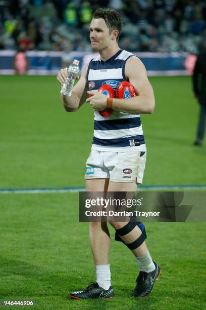 Patrick Dangerfield of the Cats limps off the ground with ice on his calf after the round four AFL match between the Geelong Cats and the St Kilda...