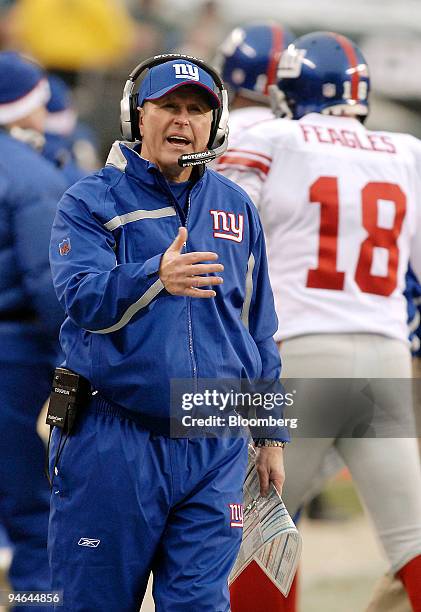 Tom Coughlin, coach of the New York Giants, calls out plays to his team during the third quarter of a National Football League game against the...