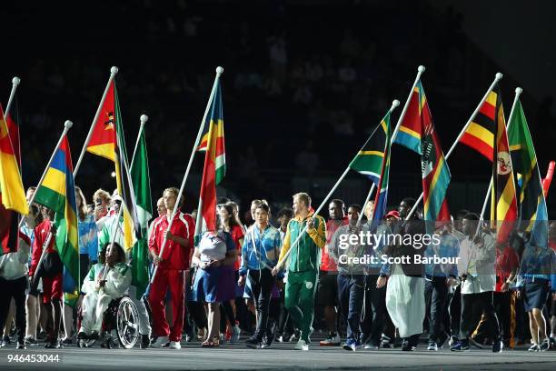 Athletes carry thier nations flags during the Closing Ceremony for the Gold Coast 2018 Commonwealth Games at Carrara Stadium on April 15, 2018 on the...