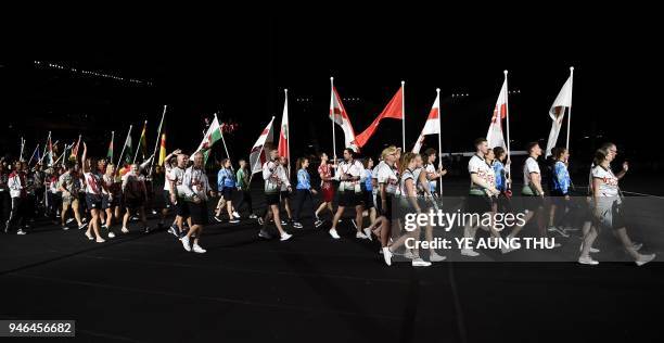 Athletes arrive for the closing ceremony of the 2018 Gold Coast Commonwealth Games at the Carrara Stadium on the Gold Coast on April 15, 2018. / AFP...