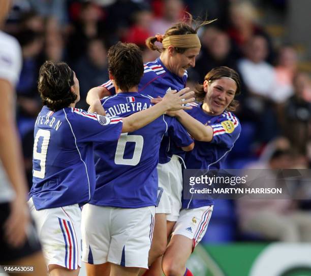 Marinette Pichon, Sandrine Soubeyrand, Stephanie Mugeret-Beghe and Elise Bussagalia celebrate the first goal for France against Norway during their...