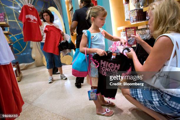 Juliana Leone center, shops for Walt Disney Co. "High School Musical" merchandise with her mother Grace Leone, right, at the World of Disney Store in...