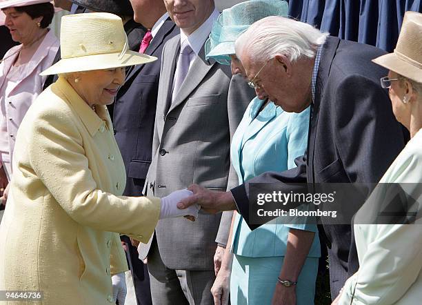Britain's Queen Elizabeth II, the U.K. Head of state, shakes hands with Northern Ireland First Minister Ian Paisley, during a visit to Coleraine, in...