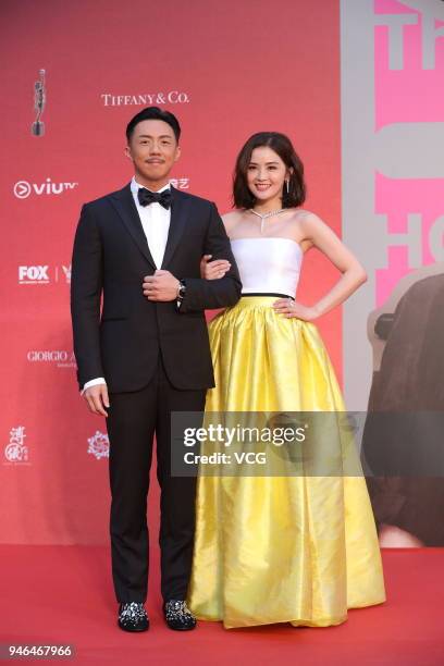 Singer/actress/host Charlene Choi and actor/host Louis Cheung pose on red carpet of the 37th Hong Kong Film Awards at Hong Kong Cultural Centre on...