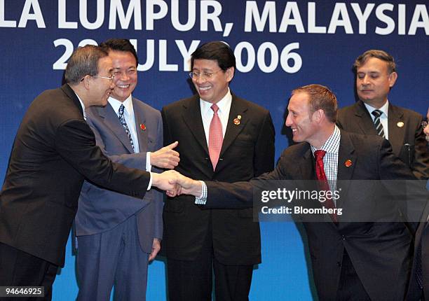 Ministers participating at the ASEAN Regional Forum in Kuala Lumpur, Malaysia, pose for a group portrait on Friday, July 28, 2006. South Korean...