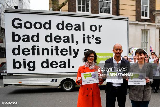 British politicians, Labour Party MP Chuka Umunna , Liberal Democrat MP Layla Moran and Green MP Caroline Lucas pose in front of an advertising board...