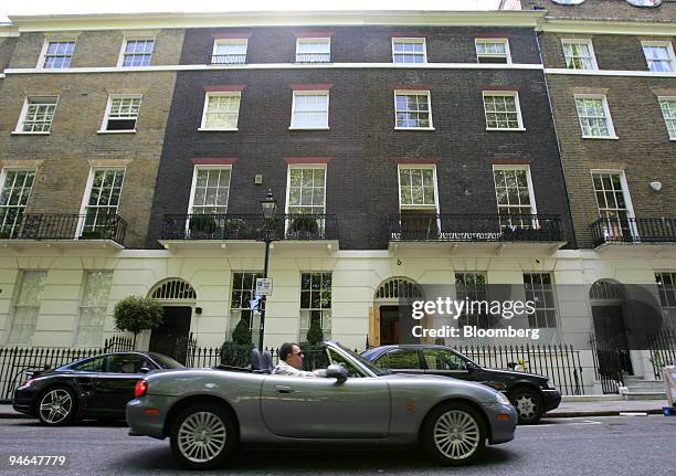 An open top car drives past U.K. Prime Minister Tony Blair's new house in London, U.K., Thursday, May 31, 2007.