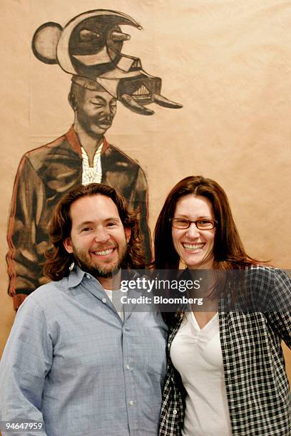 Contemporary art collector Adam Sender, with wife Leni Sender, walk the floor the opening night of the New Art Dealers Alliance art fair at the Ice...