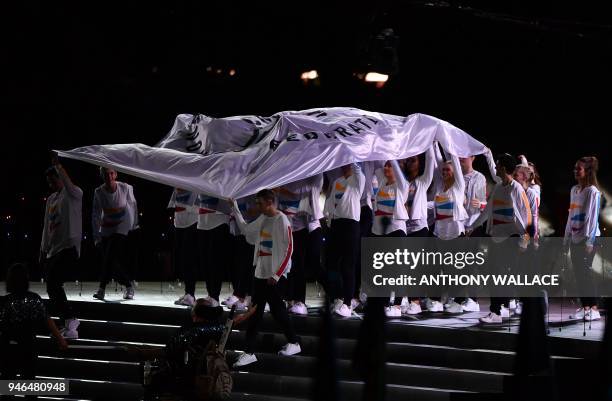 The Commonwealth Games flag is carried iside the stadium during the closing ceremony of the 2018 Gold Coast Commonwealth Games at the Carrara Stadium...