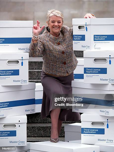 Dianne Thompsom, chief executive of Camelot submitting her bid to The National Lottery outside The National Gallery in London, Friday, February 9,...