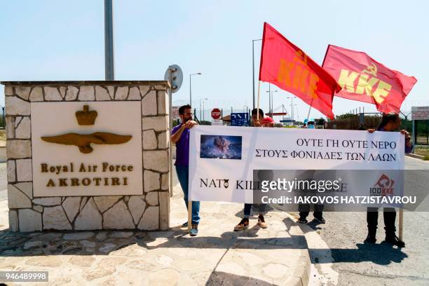 Members of the Greek Communist Part take part in an anti-war demonstration outside the Sovereign Base Area of Akrotiri, a British overseas territory...