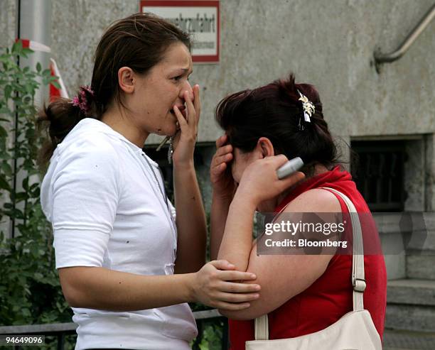 Employees of an Italian restaurant located near the site where six Italian men died in a shooting near the main train station in Duisburg, Germany,...