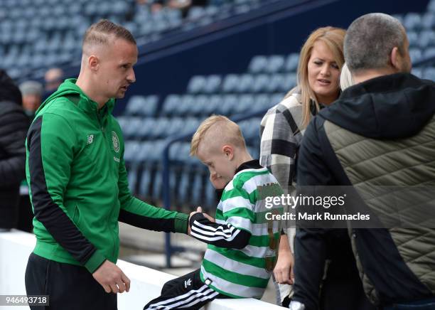 Leigh Griffiths of Celtic interacts with a young fan prior to the Scottish Cup Semi Final match between Rangers and Celtic at Hampden Park on April...