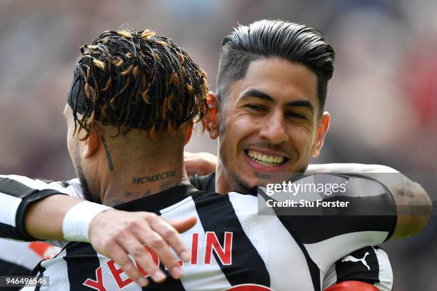 Ayoze Perez of Newcastle United celebrates with teammate Deandre Yedlin after scoring his sides first goal during the Premier League match between...