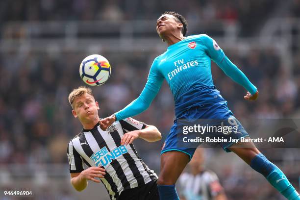 Matt Ritchie of Newcastle United and Joe Willock of Arsenal during the Premier League match between Newcastle United and Arsenal at St. James Park on...