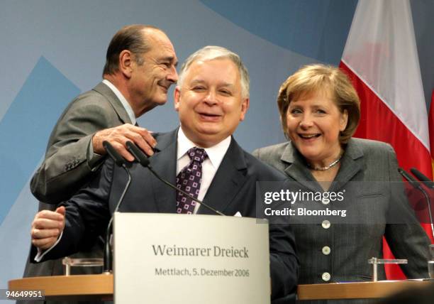 French President Jacques Chirac, left, Polish President Lech Kaczynski, center and German Chancellor Angela Merkel arrive for a press conference...