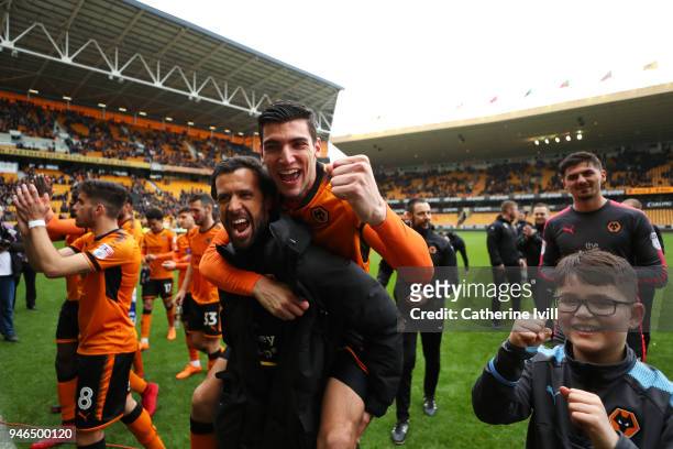 Rafa Mir of Wolverhampton Wanderers celebrates victory and celebrates getting promoted to the Premier League during the Sky Bet Championship match...